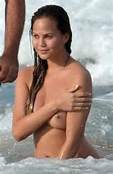 Chrissy Teigen naked on the beachâ€“topless paparazzi