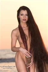 long hair latina hardbody poses nude on beach
