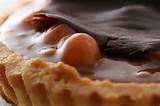 Macadamia nut and maple tart with shaved chocolate